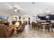 Spacious open-concept living area featuring a kitchen island, comfortable seating, and seamless flow between rooms at 218 Wellington Woods Ave, Deland, FL 32724