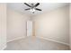Bright bedroom with neutral walls, carpet, and an open doorway, ready for personalization at 227 Blue Crystal Dr, Deland, FL 32720