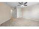 Bedroom featuring neutral carpet, paint, and ceiling fan plus a pair of doors at 227 Blue Crystal Dr, Deland, FL 32720