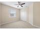 Bright bedroom with carpet, neutral walls, a ceiling fan and a closet at 227 Blue Crystal Dr, Deland, FL 32720
