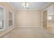 Dining area features carpet, neutral walls, and large windows for natural light at 227 Blue Crystal Dr, Deland, FL 32720