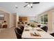 Open concept dining area featuring a view to the kitchen and backyard at 227 Blue Crystal Dr, Deland, FL 32720