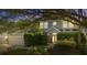 Charming two-story home with a manicured lawn and lush landscaping, offering great curb appeal at 227 Blue Crystal Dr, Deland, FL 32720