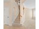 View of the foyer showcasing the staircase, a neutral color palette, and tile flooring at 227 Blue Crystal Dr, Deland, FL 32720