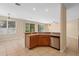 Small kitchenette has stainless steel appliances, a sink, and a view of the garden at 227 Blue Crystal Dr, Deland, FL 32720