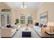Bright living room featuring neutral tones, stylish furniture, and plenty of natural light at 227 Blue Crystal Dr, Deland, FL 32720