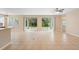 Spacious living room with tile floors, large sliding doors, and backyard access at 227 Blue Crystal Dr, Deland, FL 32720