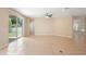 Bright, expansive living area with tile floors and backyard access through sliding doors at 227 Blue Crystal Dr, Deland, FL 32720
