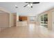 Open living space with plenty of natural light, tile flooring, and access to the backyard at 227 Blue Crystal Dr, Deland, FL 32720