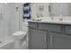 Bathroom featuring a toilet, vanity, mirror, and glass enclosed walk in shower at 241 Old Moss Cir, Deland, FL 32724