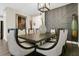 Elegant dining room showcases a sleek table, statement chairs, and designer wall accents at 241 Old Moss Cir, Deland, FL 32724