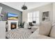 Living room featuring a fireplace, mounted television, and workstation at 241 Old Moss Cir, Deland, FL 32724