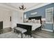 This main bedroom features a dark wood bedframe, tray ceilings, and natural light at 241 Old Moss Cir, Deland, FL 32724