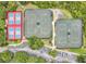 Overhead view of colorful tennis and pickleball courts with trees, parking, and some partial views of the surrounding neighborhood at 241 Old Moss Cir, Deland, FL 32724