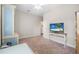 Neutral bedroom has a wall-mounted TV, chair railing, and is perfect for customization at 2412 Regency Park Dr, Deland, FL 32724