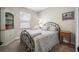 Comfortable bedroom with natural light, decorative touches, and carpet floors at 2412 Regency Park Dr, Deland, FL 32724