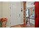 Welcoming foyer leads to a cozy living space, showcasing hardwood floors and rustic accents at 2412 Regency Park Dr, Deland, FL 32724