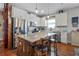 Bright kitchen with white cabinets, granite countertops, stainless steel appliances, and a central island at 2412 Regency Park Dr, Deland, FL 32724