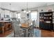 Charming kitchen and dining area with white cabinets and wooden accents at 2412 Regency Park Dr, Deland, FL 32724