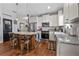 Lovely kitchen featuring a kitchen island, granite countertops, and modern appliances at 2412 Regency Park Dr, Deland, FL 32724