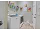 Well-equipped laundry room has modern machines and extra storage for household essentials at 2412 Regency Park Dr, Deland, FL 32724