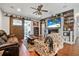 Comfortable living room with a rustic accent wall and sliding barn door at 2412 Regency Park Dr, Deland, FL 32724