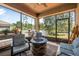 Relaxing screened patio features a fire pit, grill, and outdoor seating ideal for entertaining at 2412 Regency Park Dr, Deland, FL 32724