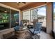 Welcoming outdoor patio features ample seating, a grill, and a view of the serene surroundings at 2412 Regency Park Dr, Deland, FL 32724
