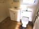 Bathroom featuring a vanity with cabinet, toilet, and window at 2647 Brookline Ave, New Smyrna Beach, FL 32168