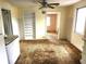 View of the kitchen including built-in shelving, ceiling fan, and passage to another room at 2647 Brookline Ave, New Smyrna Beach, FL 32168