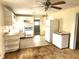 Functional kitchen with white appliances, ample cabinetry, and a ceiling fan at 2647 Brookline Ave, New Smyrna Beach, FL 32168
