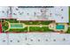 Aerial view of well-manicured condo complex featuring bocce ball, swimming pool, and shuffleboard at 2711 N Halifax Ave # 264, Daytona Beach, FL 32118