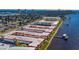 Waterfront community featuring condo buildings, manicured lawns, pier, and city views at 2711 N Halifax Ave # 264, Daytona Beach, FL 32118