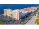 Expansive aerial view of the waterfront condo building, showcasing the surrounding parking area at 2711 N Halifax Ave # 264, Daytona Beach, FL 32118