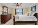 Bright bedroom with a large dresser, ceiling fan, water view, and neutral decor at 2711 N Halifax Ave # 264, Daytona Beach, FL 32118