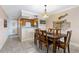 Inviting dining area with wood table, coastal decor, and a view of the kitchen at 2711 N Halifax Ave # 264, Daytona Beach, FL 32118