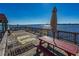 Wooden dock features picnic tables with an umbrella offering waterfront relaxation with scenic views at 2711 N Halifax Ave # 264, Daytona Beach, FL 32118