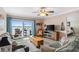 Relax in this living room with cozy seating, large windows, and beautiful waterfront views at 2711 N Halifax Ave # 264, Daytona Beach, FL 32118