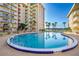 Community pool with comfortable lounge seating and waterfront views at 2711 N Halifax Ave # 264, Daytona Beach, FL 32118