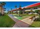 Well-kept shuffleboard courts with benches near appealing condo buildings and green lawns at 2711 N Halifax Ave # 264, Daytona Beach, FL 32118