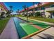 Active shuffleboard courts amidst lush landscaping offer outdoor recreation near attractive condo buildings at 2711 N Halifax Ave # 264, Daytona Beach, FL 32118
