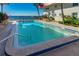 Refreshing swimming pool with waterfront views, with lounge chairs and palm trees on the deck at 2711 N Halifax Ave # 264, Daytona Beach, FL 32118