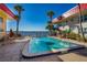 Inviting community swimming pool offers a refreshing retreat with waterfront views, surrounded by palm trees at 2711 N Halifax Ave # 264, Daytona Beach, FL 32118
