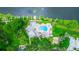 Aerial shot of the community pool, dock, and waterway showcasing the recreational amenities and natural setting at 275 Bayou Cir, Debary, FL 32713