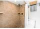 Tiled walk-in shower with a rainfall showerhead and tiled flooring at 275 Bayou Cir, Debary, FL 32713
