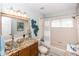 Modern bathroom with granite countertops, unique bowl sink, and separate bathtub and shower at 275 Bayou Cir, Debary, FL 32713