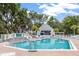 Beautiful community pool with a spacious deck area and clubhouse, perfect for relaxation and recreation at 275 Bayou Cir, Debary, FL 32713