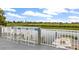 Deck with bar chairs overlooking the waterway, providing a relaxing outdoor space for entertaining at 275 Bayou Cir, Debary, FL 32713