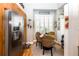 Bright breakfast nook features woven chairs, stainless steel refrigerator and lots of light at 275 Bayou Cir, Debary, FL 32713