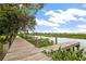 Scenic view of a wooden dock and waterway, ideal for boating and enjoying the natural surroundings at 275 Bayou Cir, Debary, FL 32713